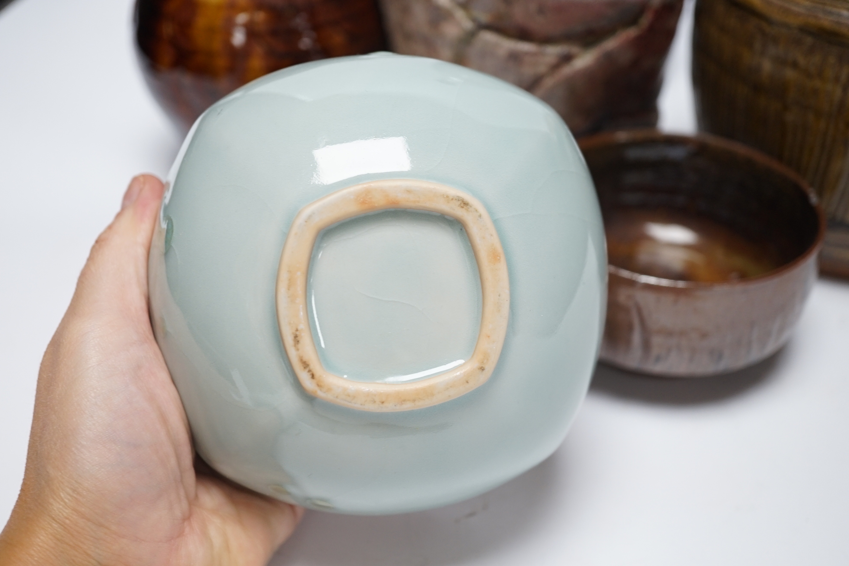 Studio ceramics to include a St. Ives moulded jug and an ash glazed jar and cover marked 'MD' etc. St Ives jug 15cm high